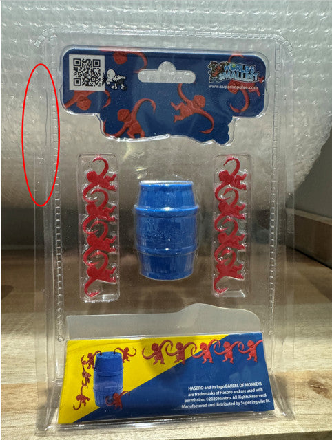 World's Smallest Barrel of Monkey's - packaging damage (top left)